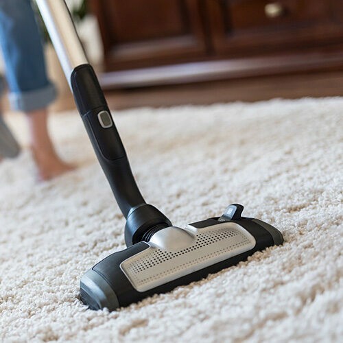 Rug vacuuming | Fairmont Flooring