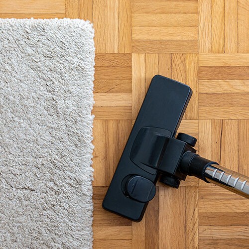 Floor cleaning by vacuum cleaner | Fairmont Flooring